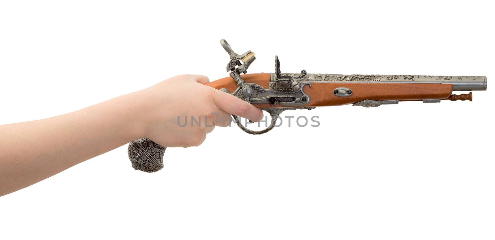 Ancient pistol on female hand on the white background