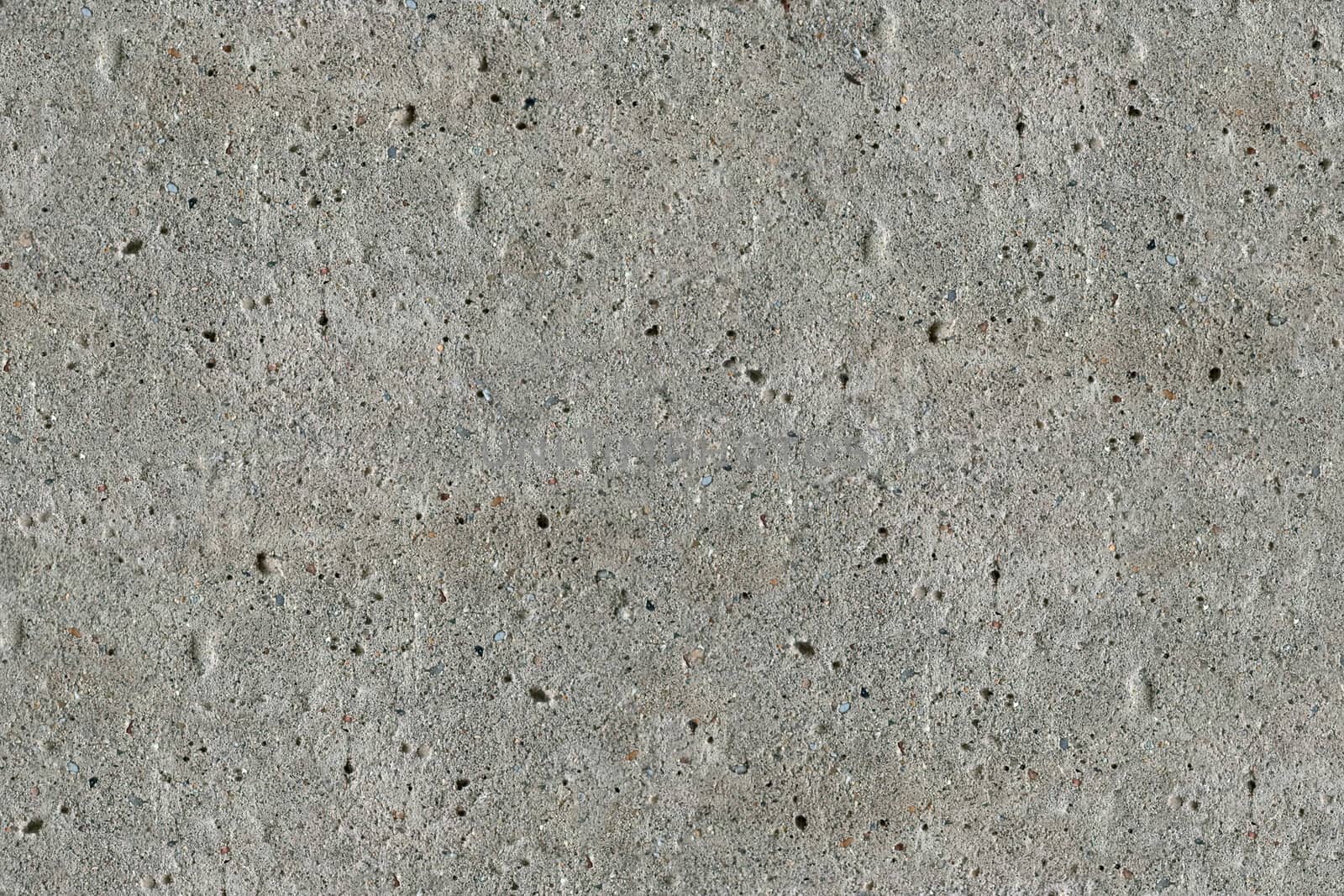 The texture of concrete. Uniform illumination. A typical rough uneven surface.