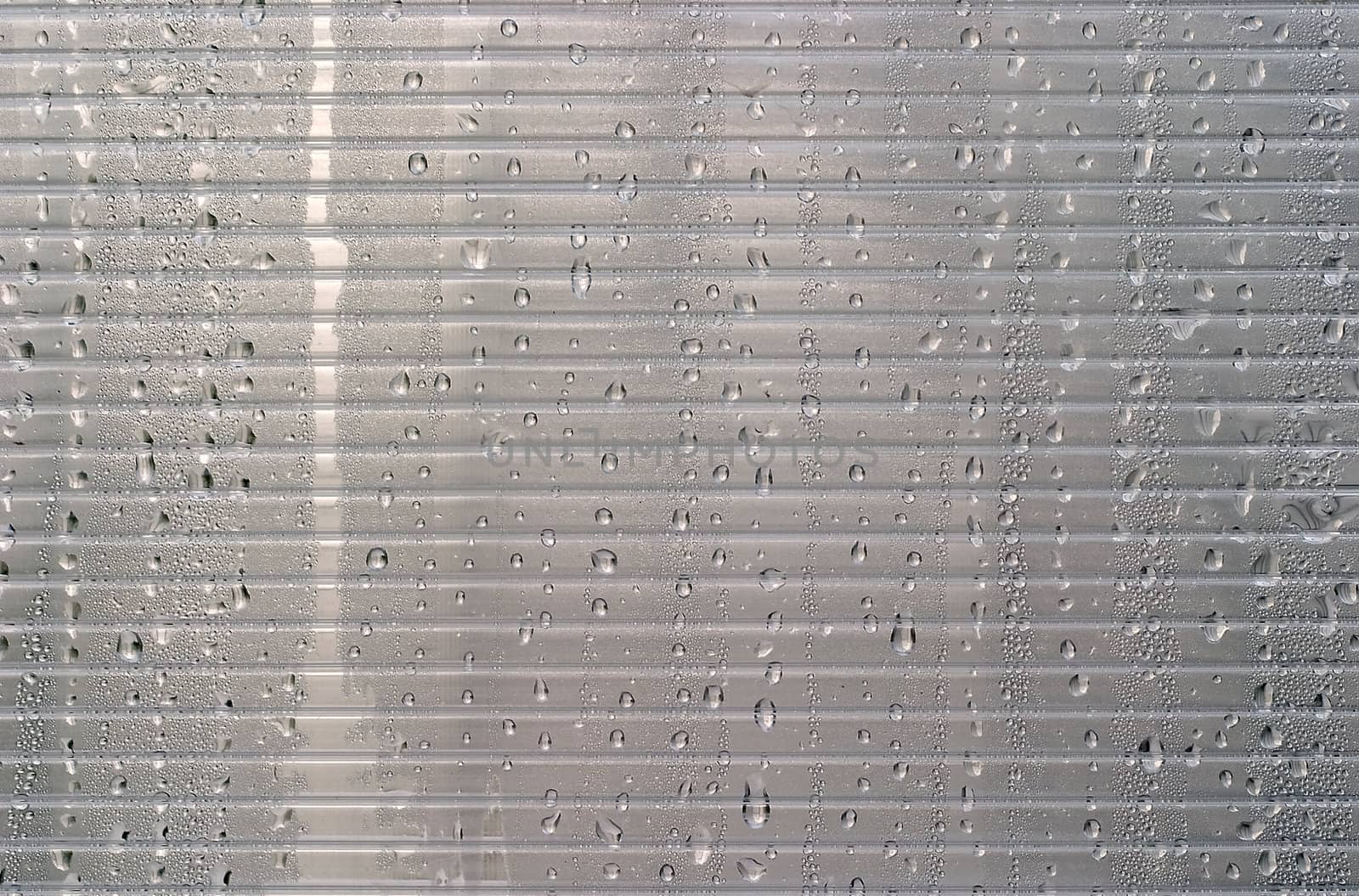 Water droplets on a transparent background with stripes. Abstract stylish background for any designer's purposes