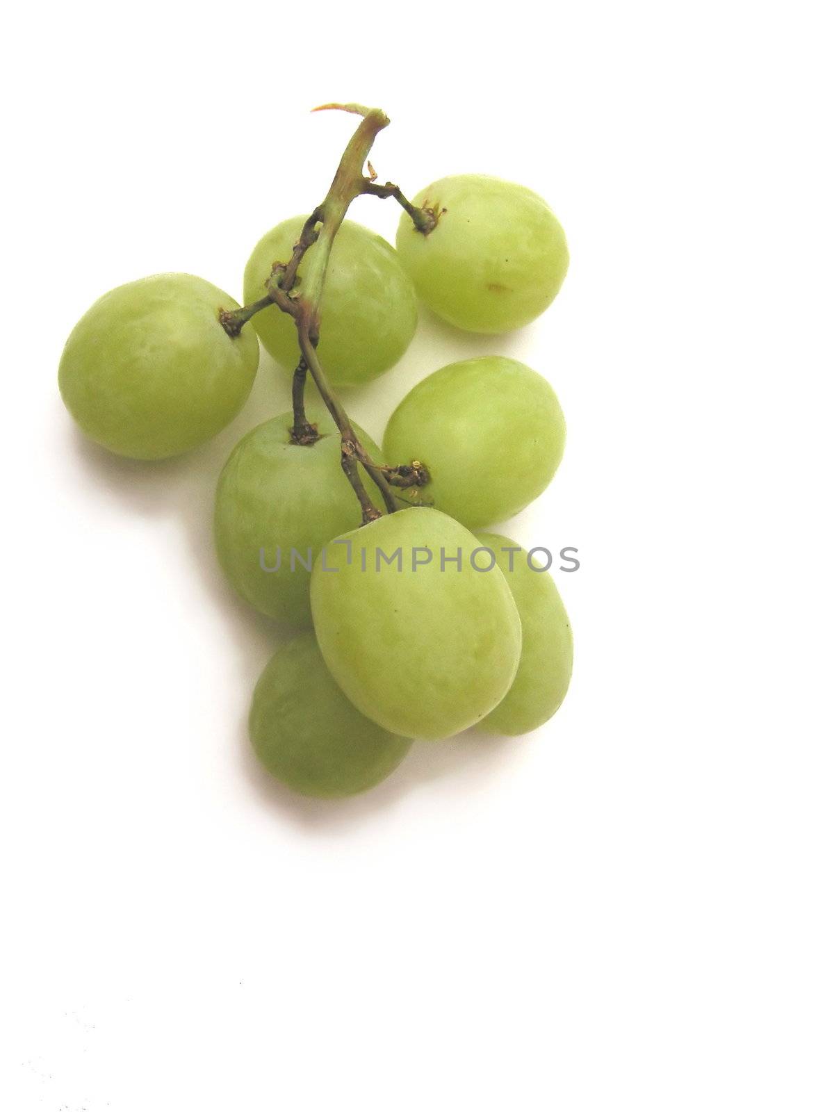 small bunch of grapes over a white background