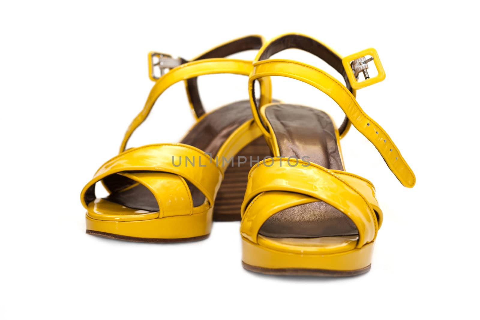 Yellow lady sandals insulated on white background