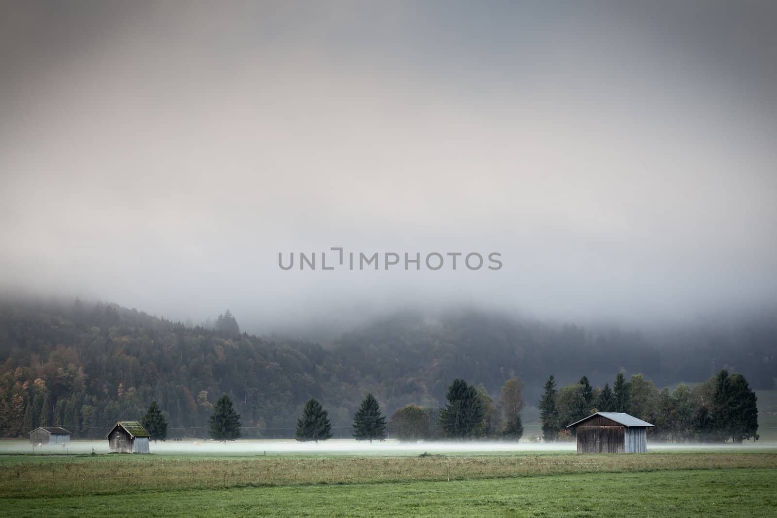 An image of a beautiful landscape with fog in bavaria germany