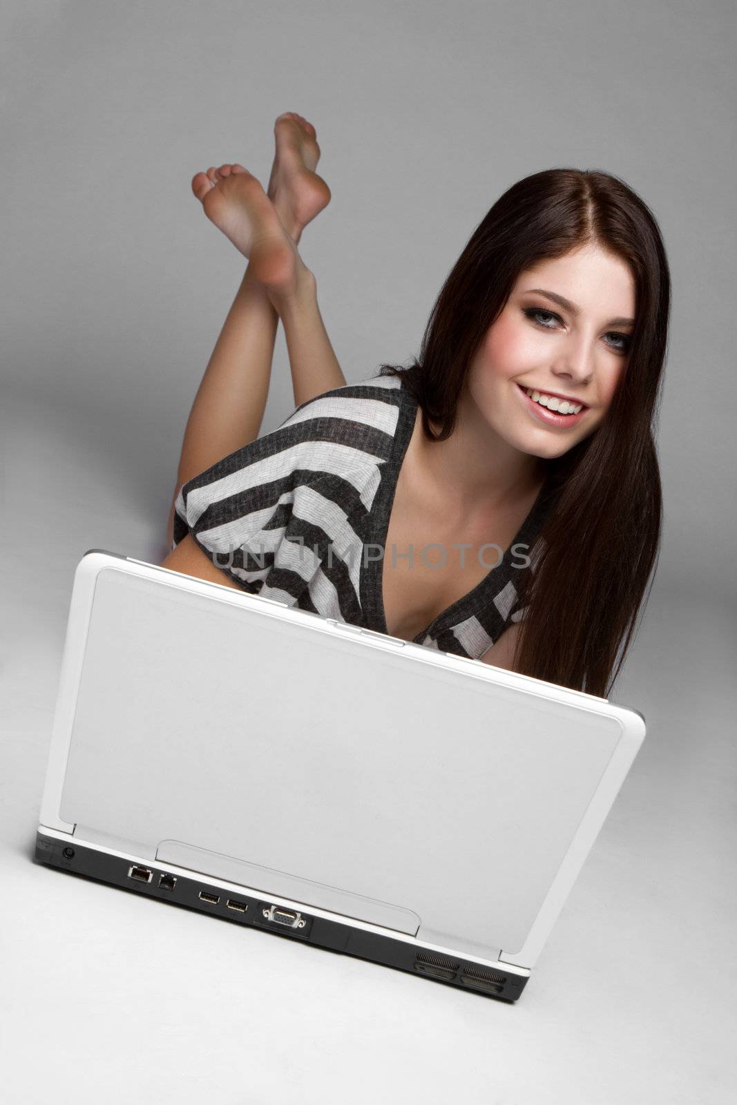 Pretty smiling teen laptop girl