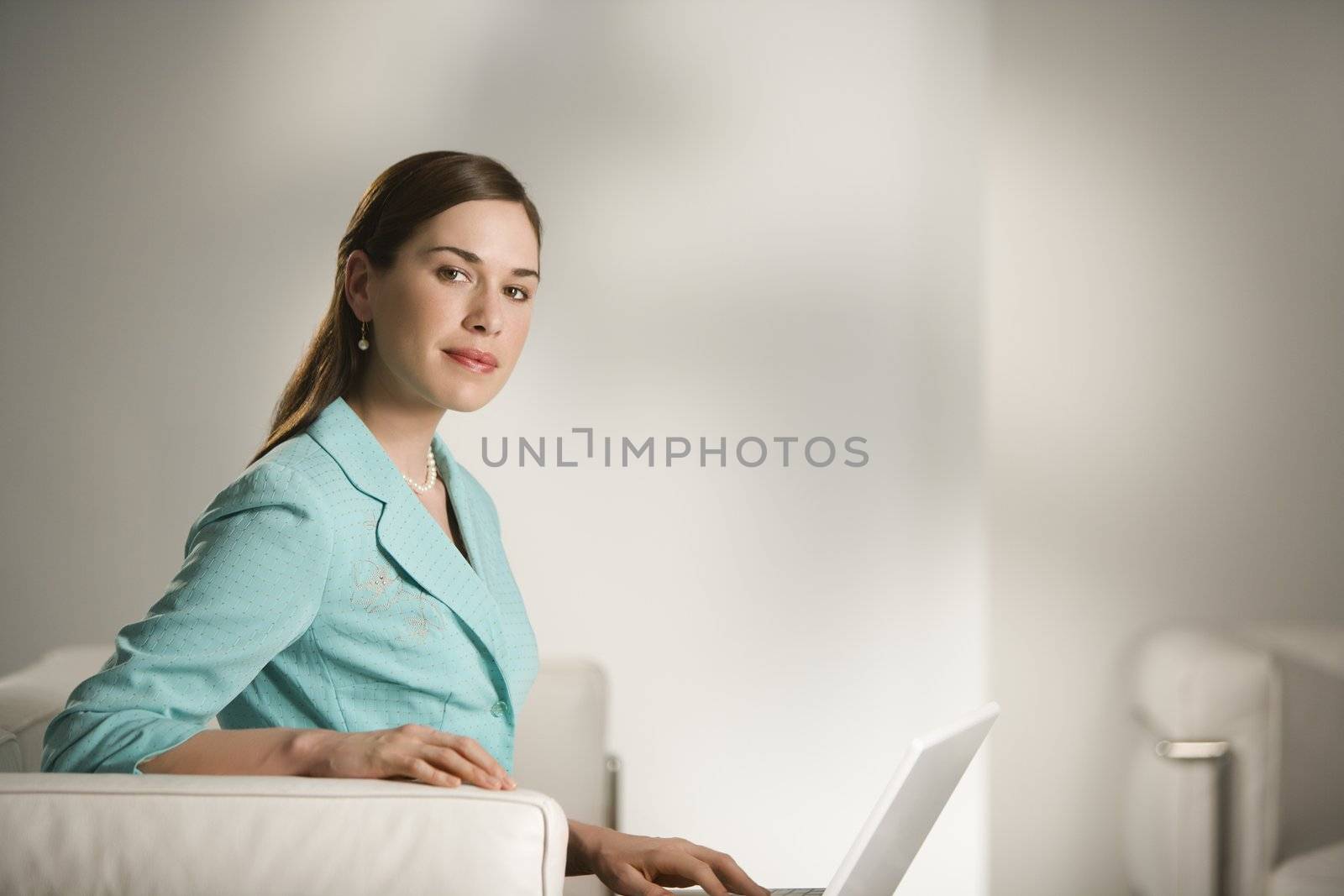 Woman working on laptop. by iofoto