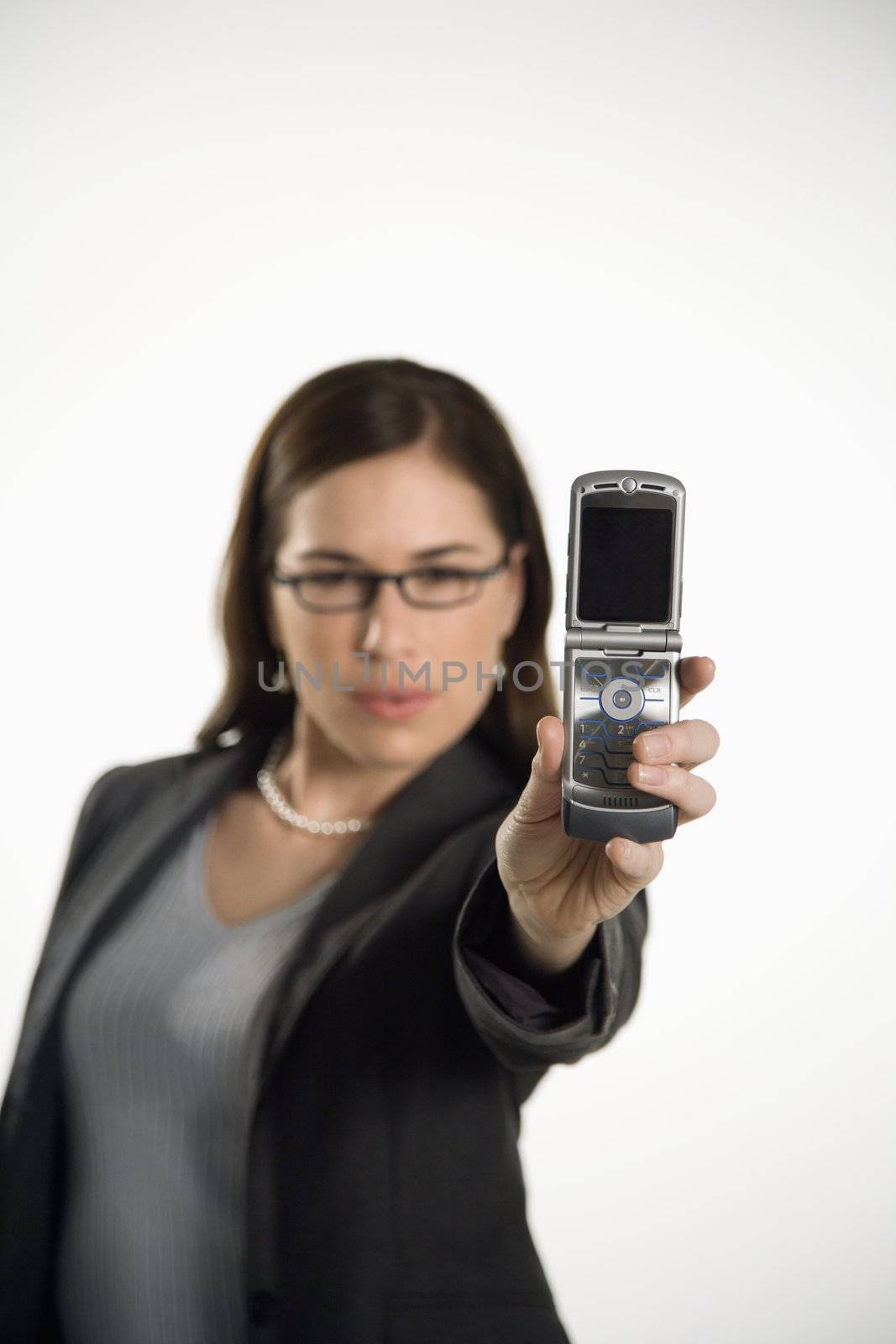 Woman using camera phone. by iofoto