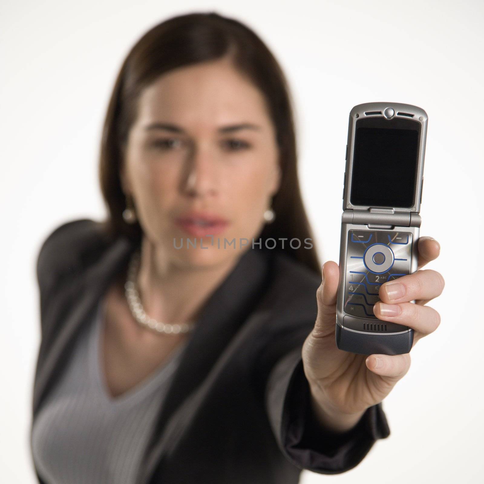 Woman and cell phone. by iofoto