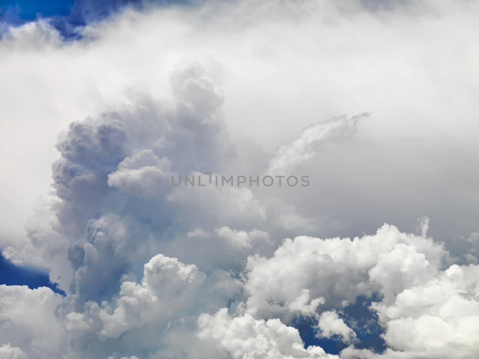 Large fluffy clouds in sky.