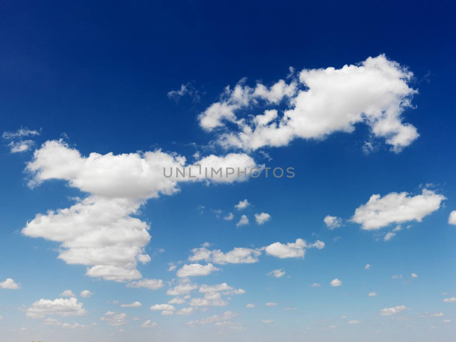 Cumulus cloud formation in blue sky.