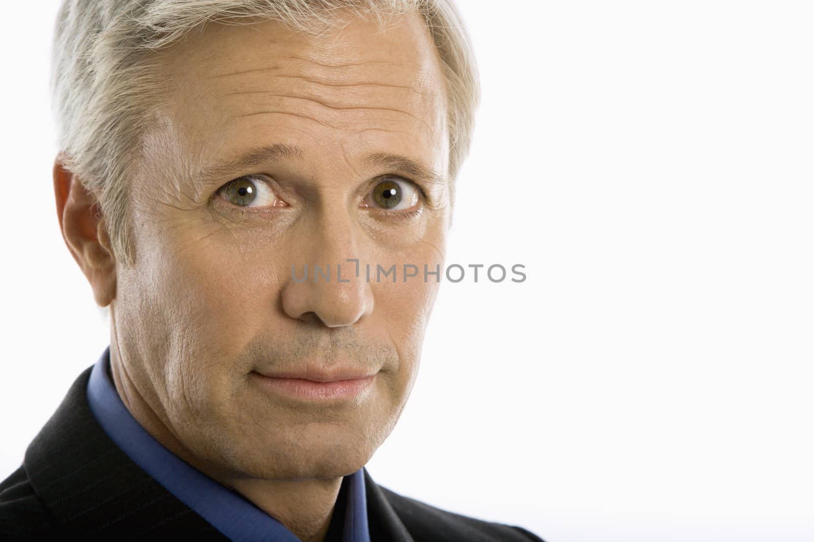 Middle aged Caucasian businessman head shot.