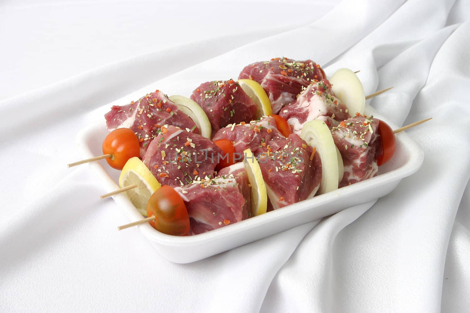 Preparation of a fresh shish kebab with vegetables