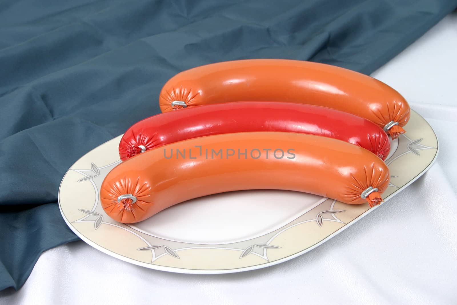Ready boiled sausage on a plate