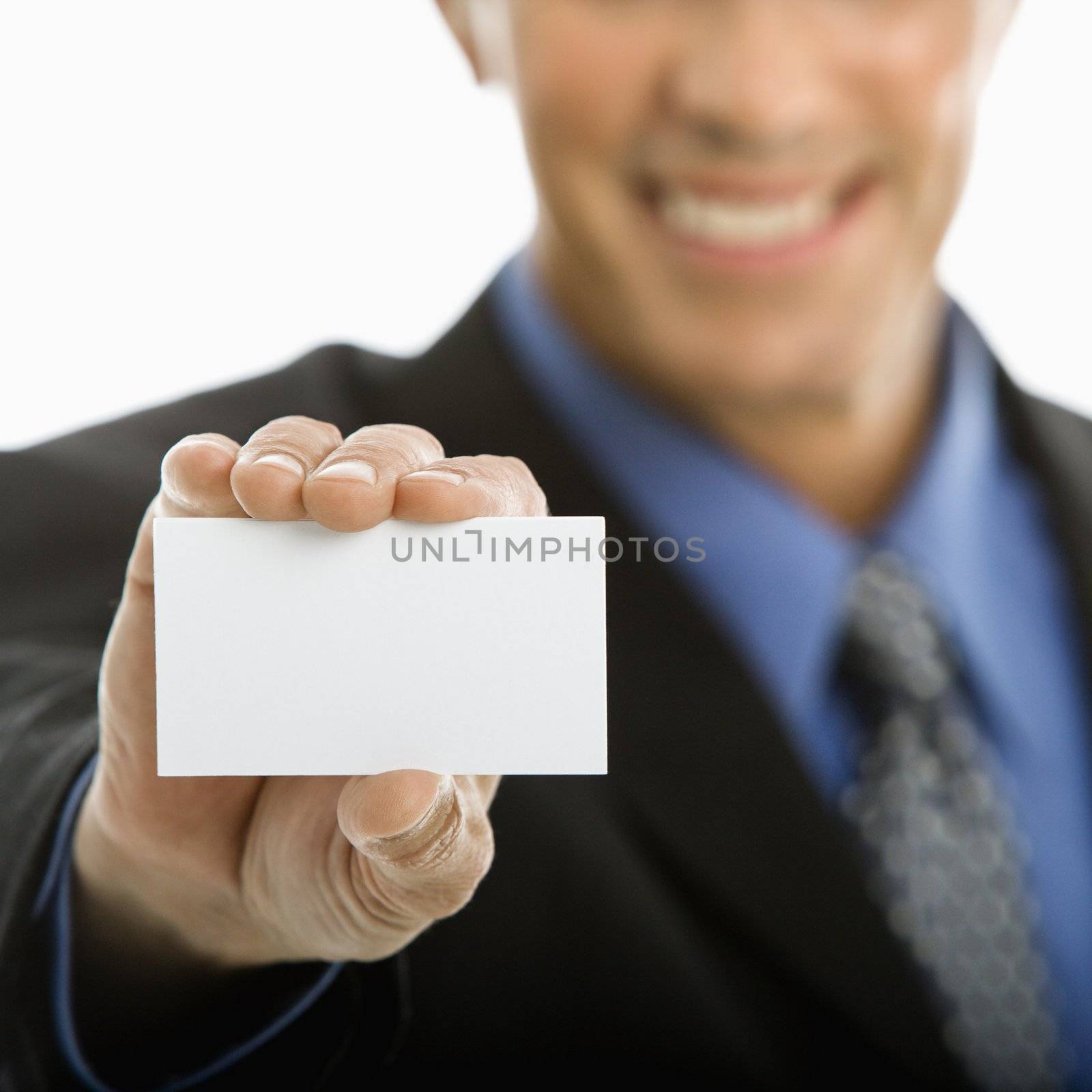 Man holding business card. by iofoto