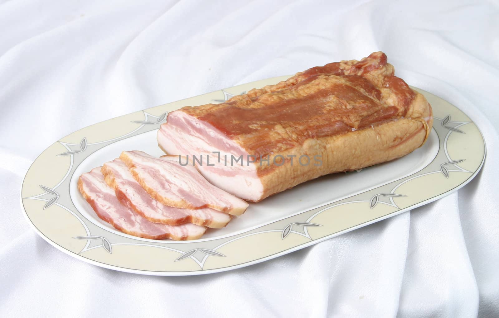 delicious applewood-smoked bacon atop a cutting