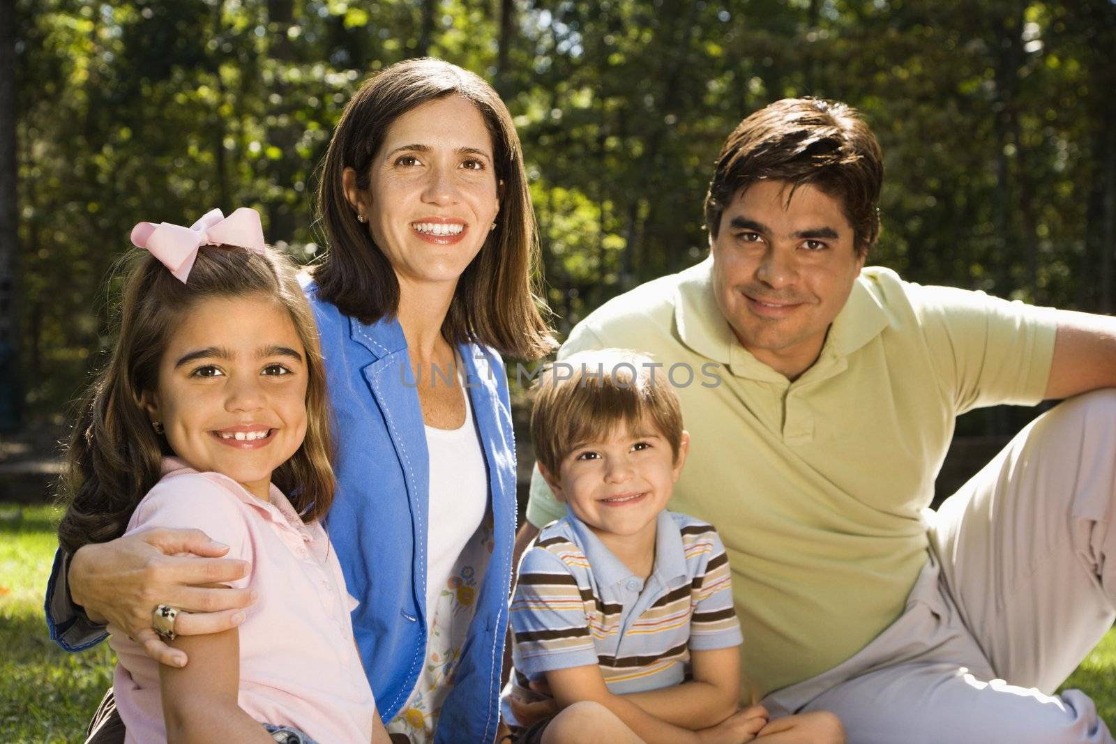 Hispanic outdoor family portrait.