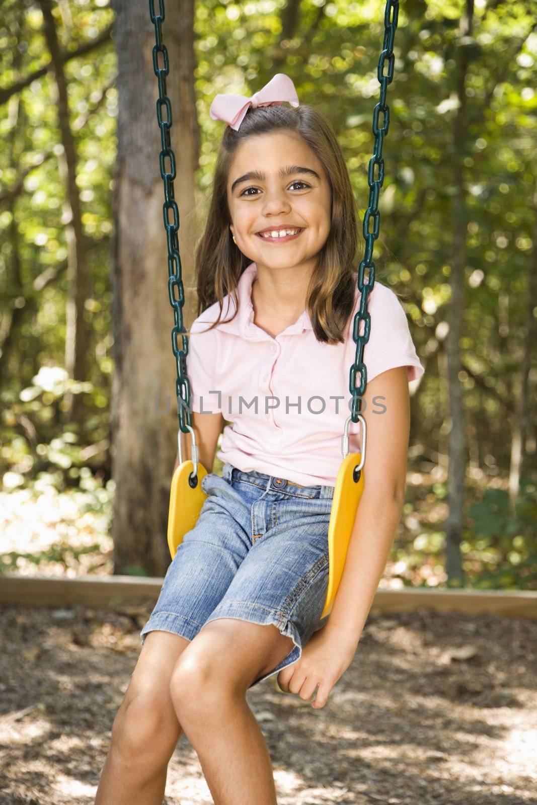Girl on swing. by iofoto