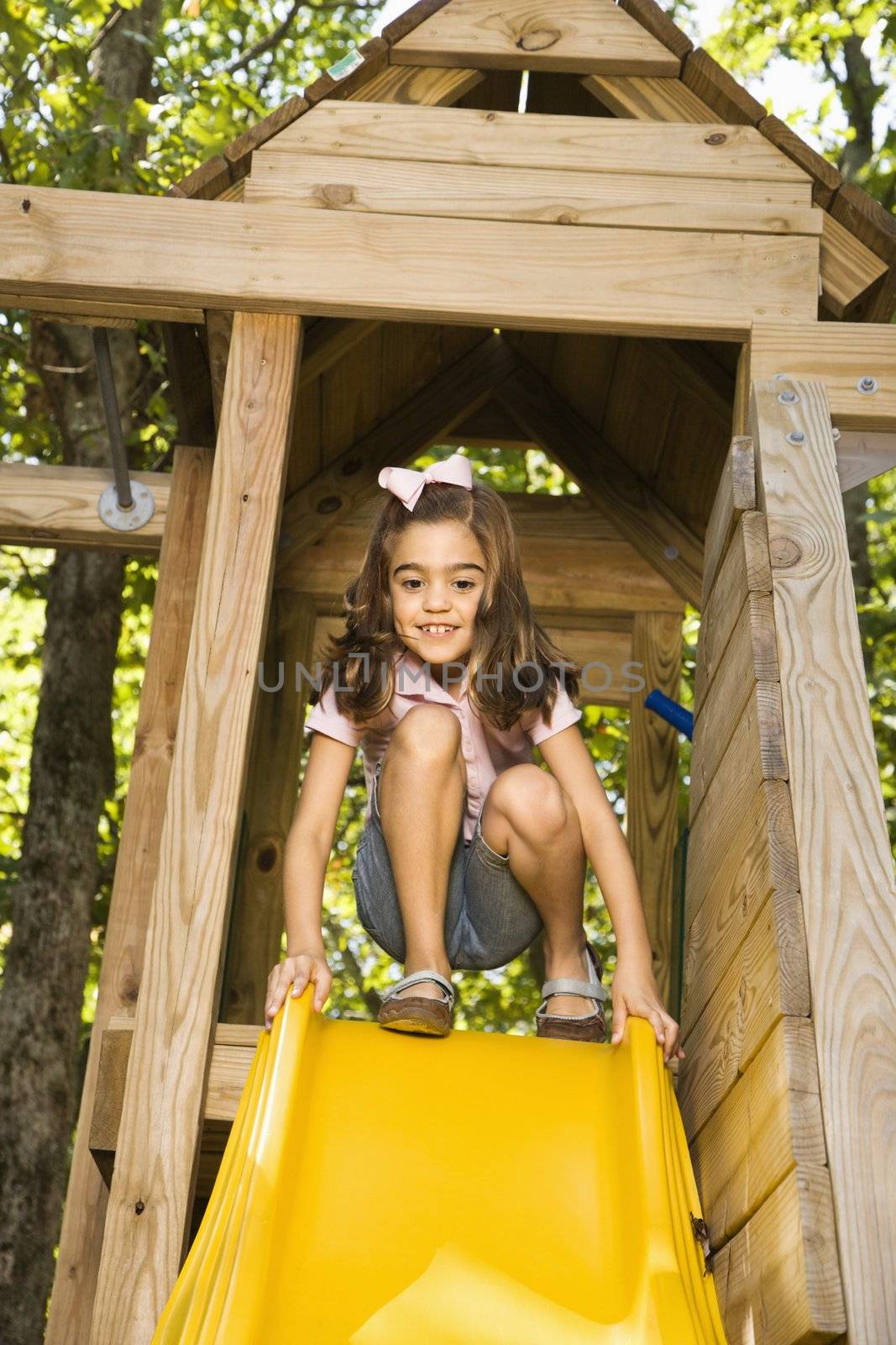 Girl on slide. by iofoto