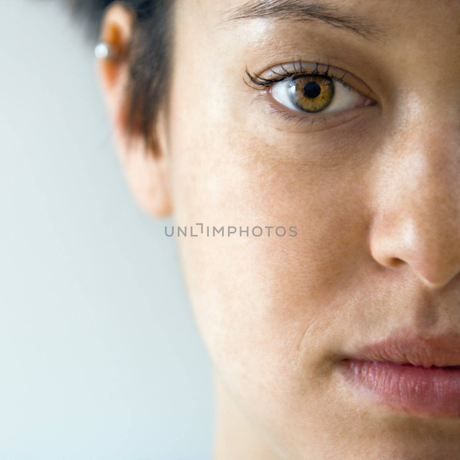 Woman face close up by iofoto