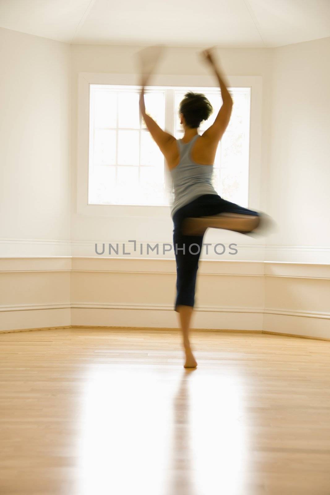 Dancing woman in motion by iofoto
