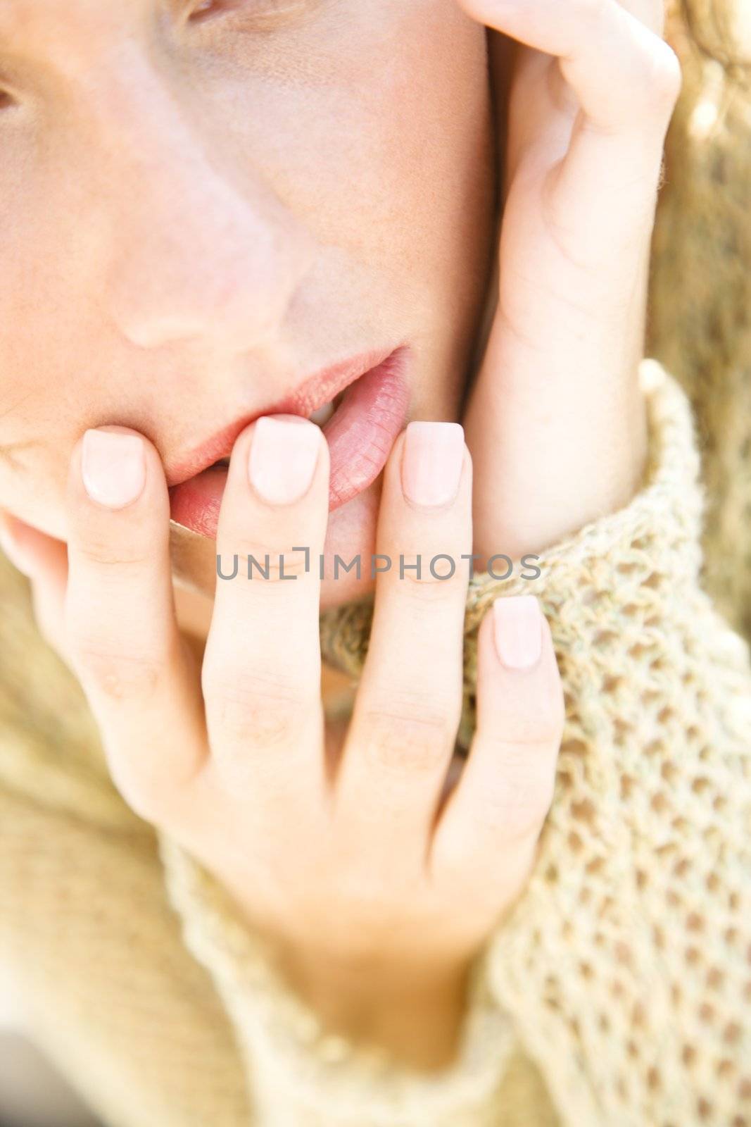 Close-up portrait of serious Caucasian young adult female.