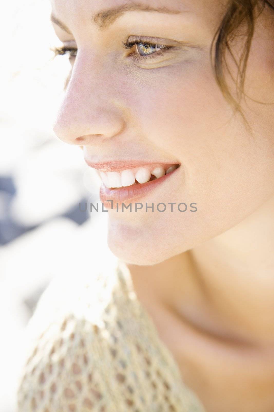 Close-up portrait of smiling Caucasian young adult female.