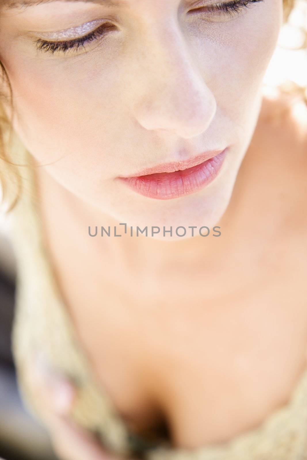 Close-up portrait of serious Caucasian young adult female.