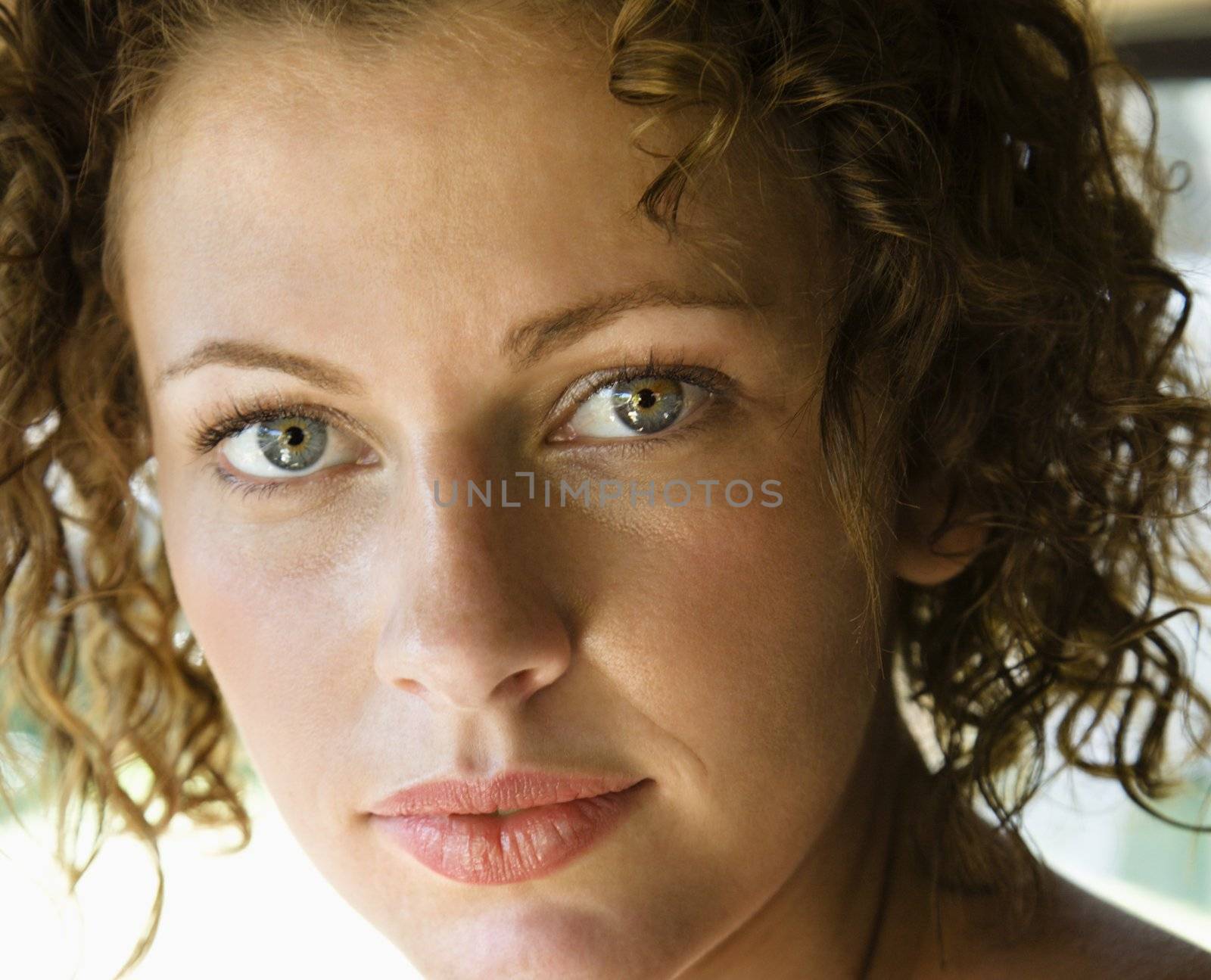 Close-up of Caucasian young adult female looking at viewer