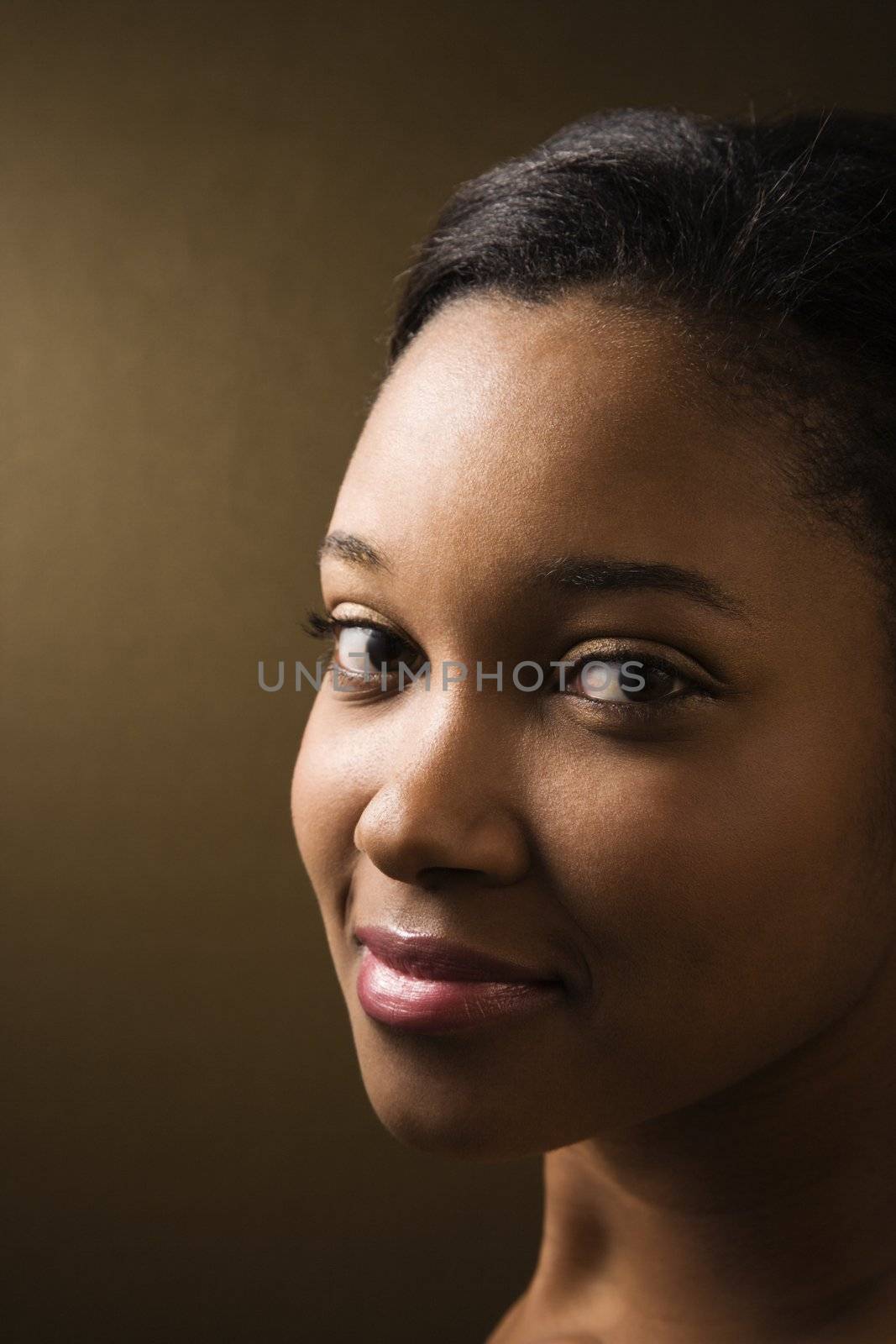 Smiling African-American young adult female looking at viewer