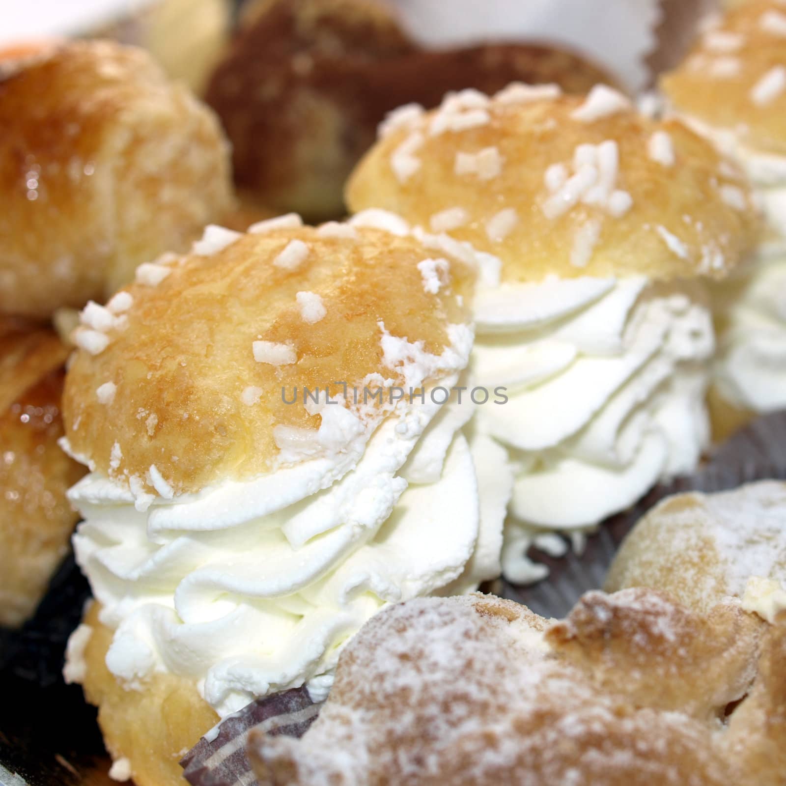 Mixed pastries with chocolate, cream, fruit