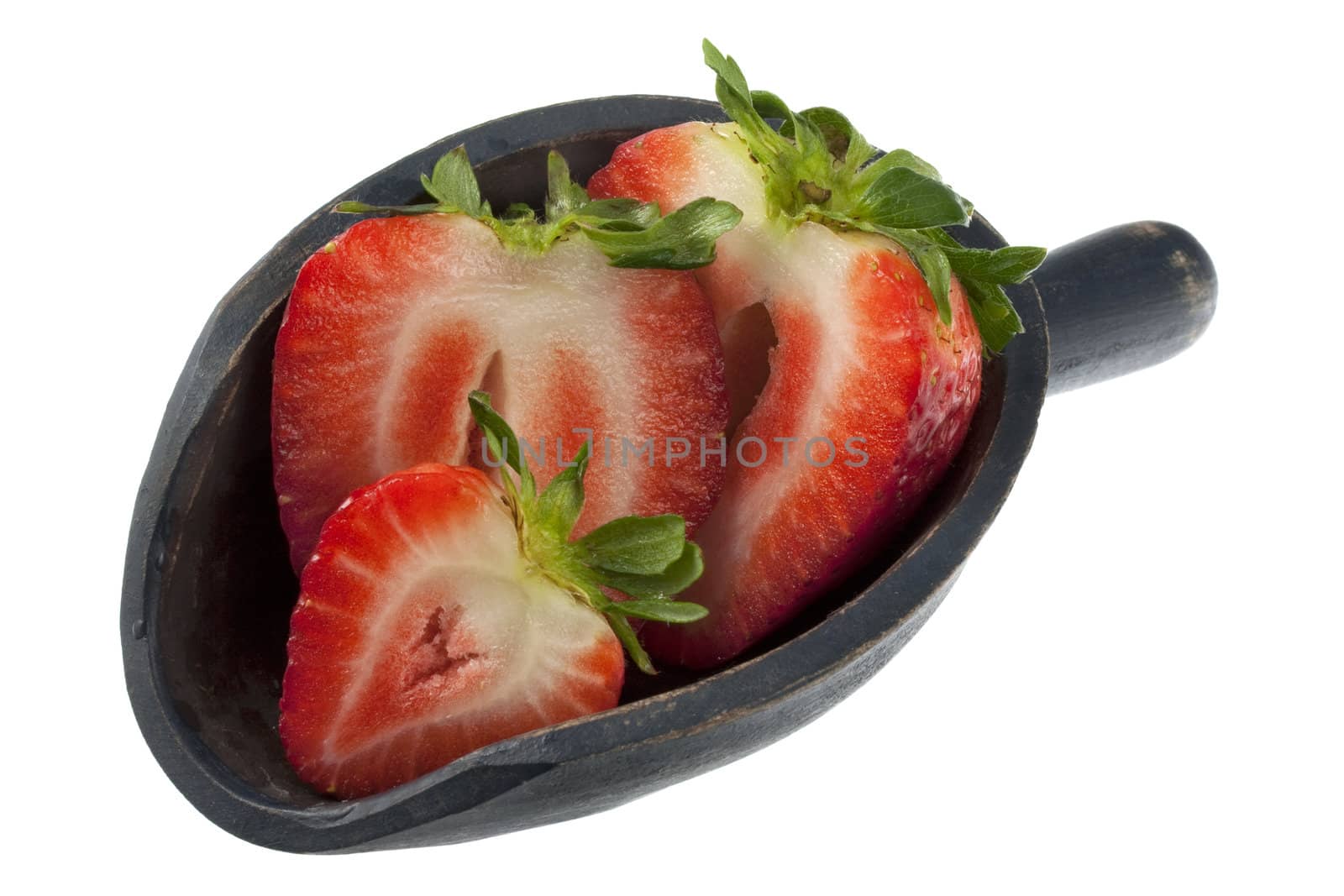 giant sliced strawberry on a rustic, wooden scoop, isolated on white