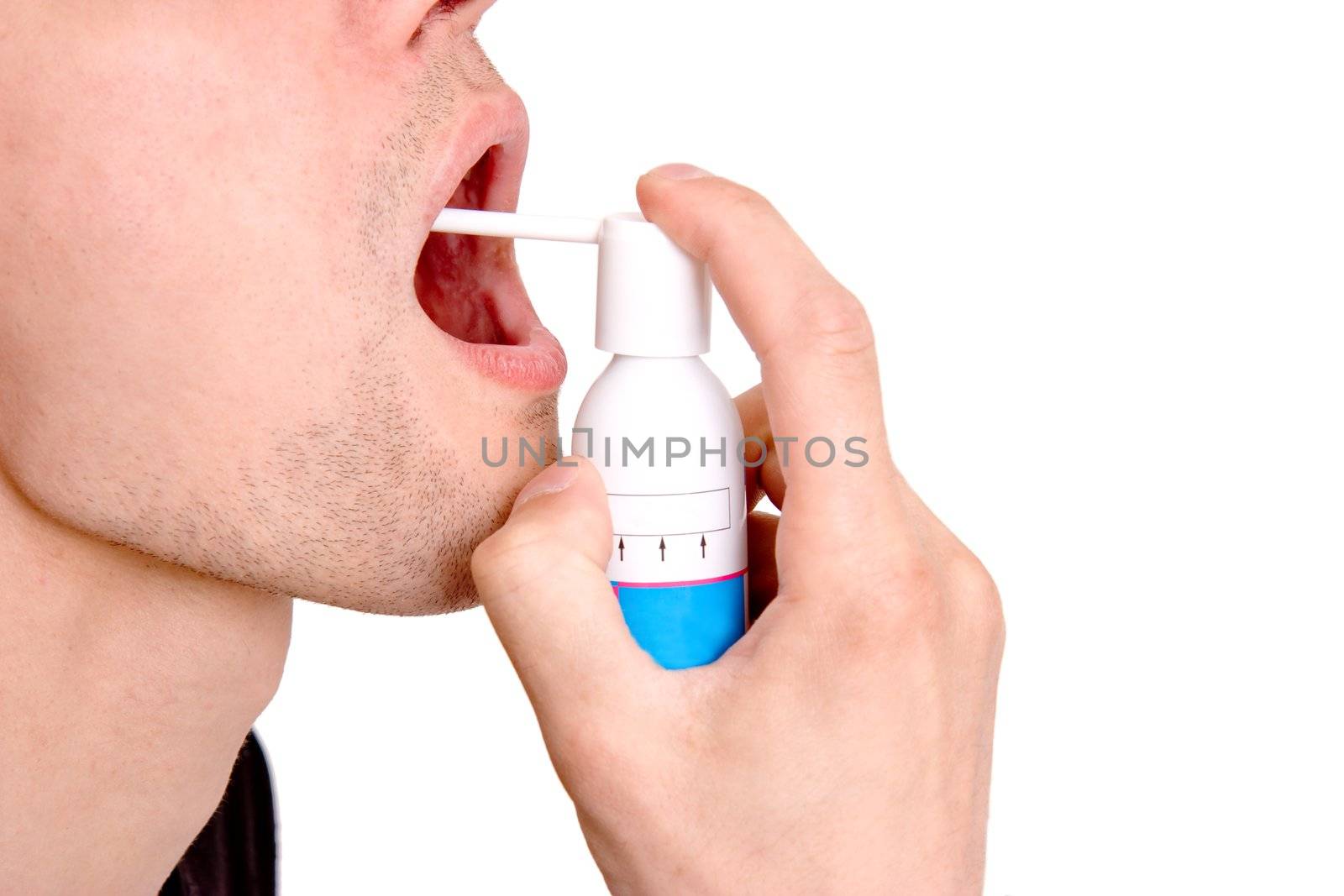 On a white background the man sprays a medicine to itself in a mouth