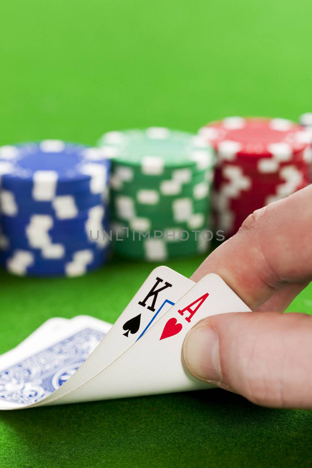 Playing poker in the casino with winning hand