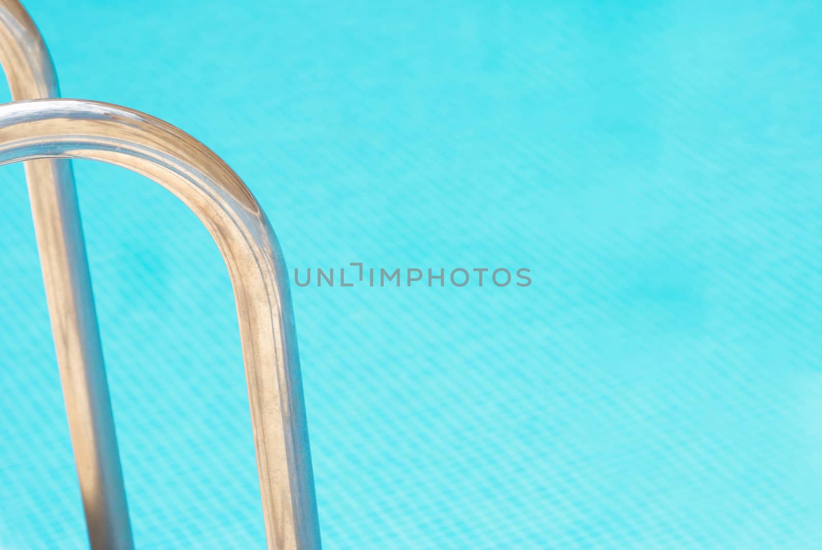 Pool abstract, ladder railings and copy space on the water by hemeroskopion