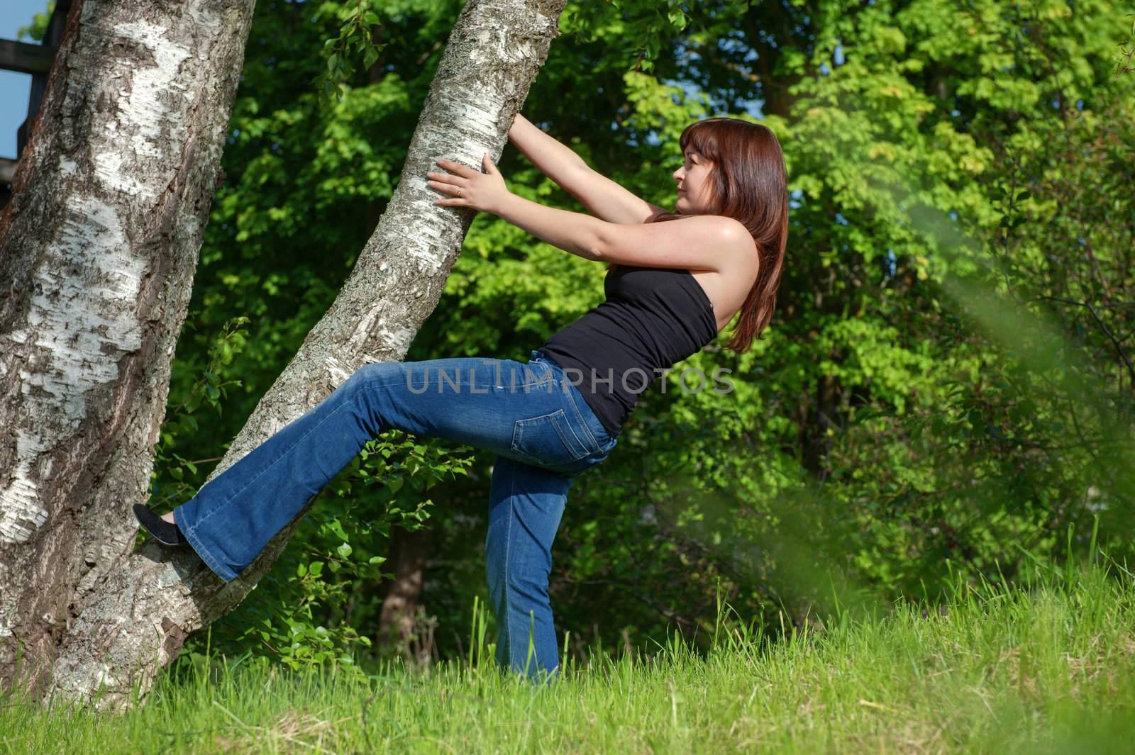 Beauty tomboy trying to get up the tree.
