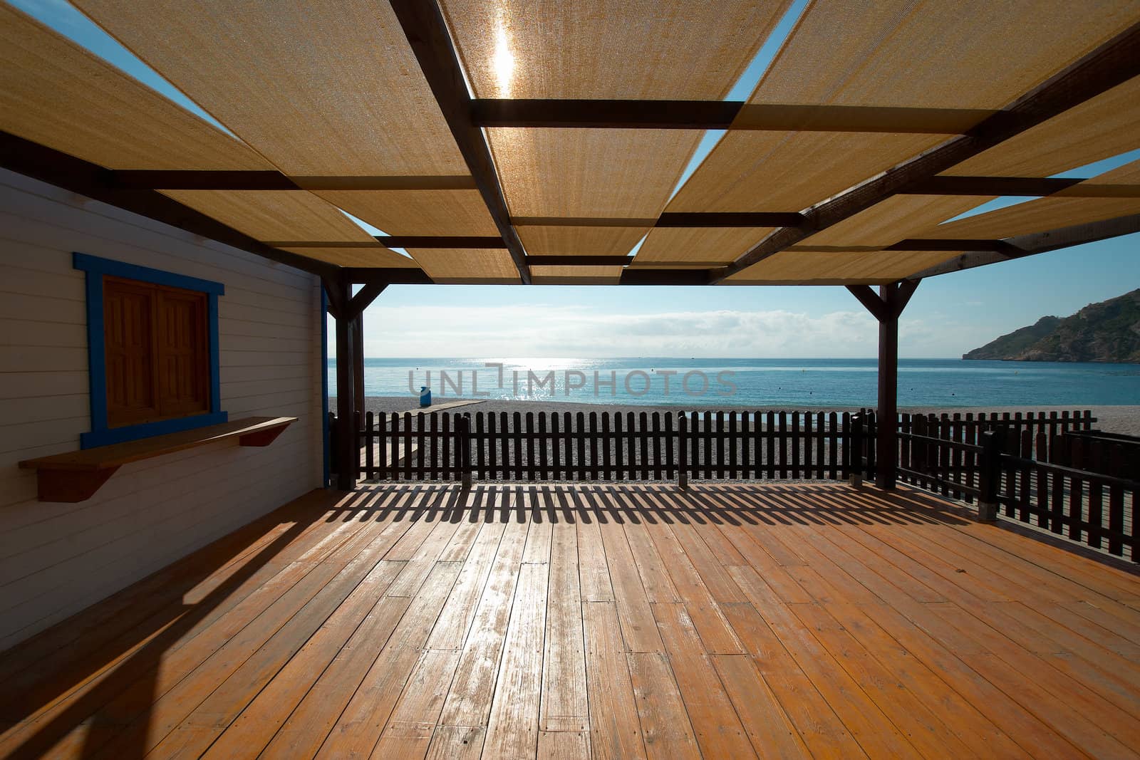A wooden terrace with views on the sea