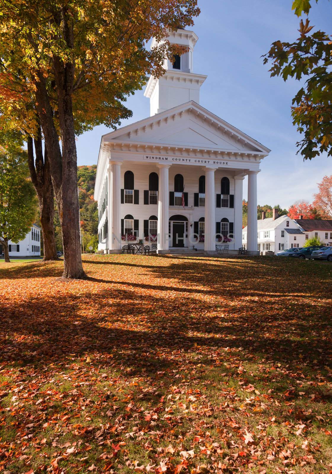 Autumnal shot of the Windham County Court House in fall as the bright trees turn orange and red