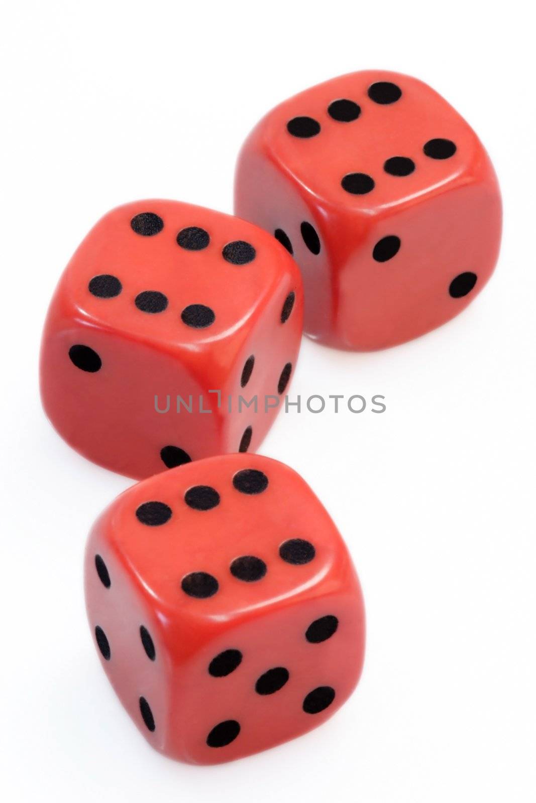 Three red dices over white background
