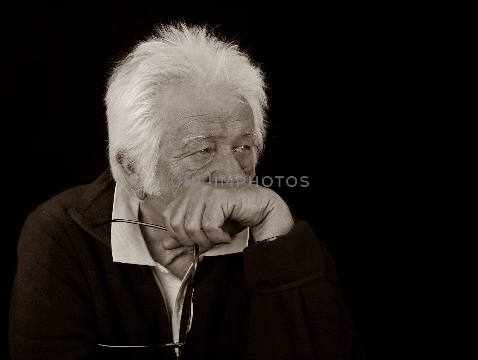 Black and White Portrait of an elderly man with a serious expression.