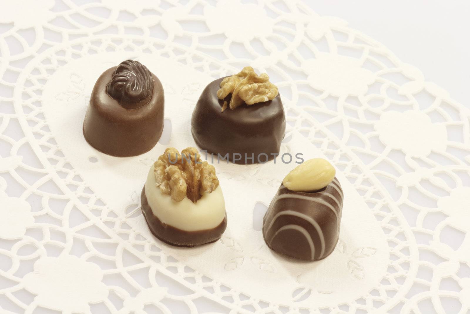 Four tasty chocolates with nuts