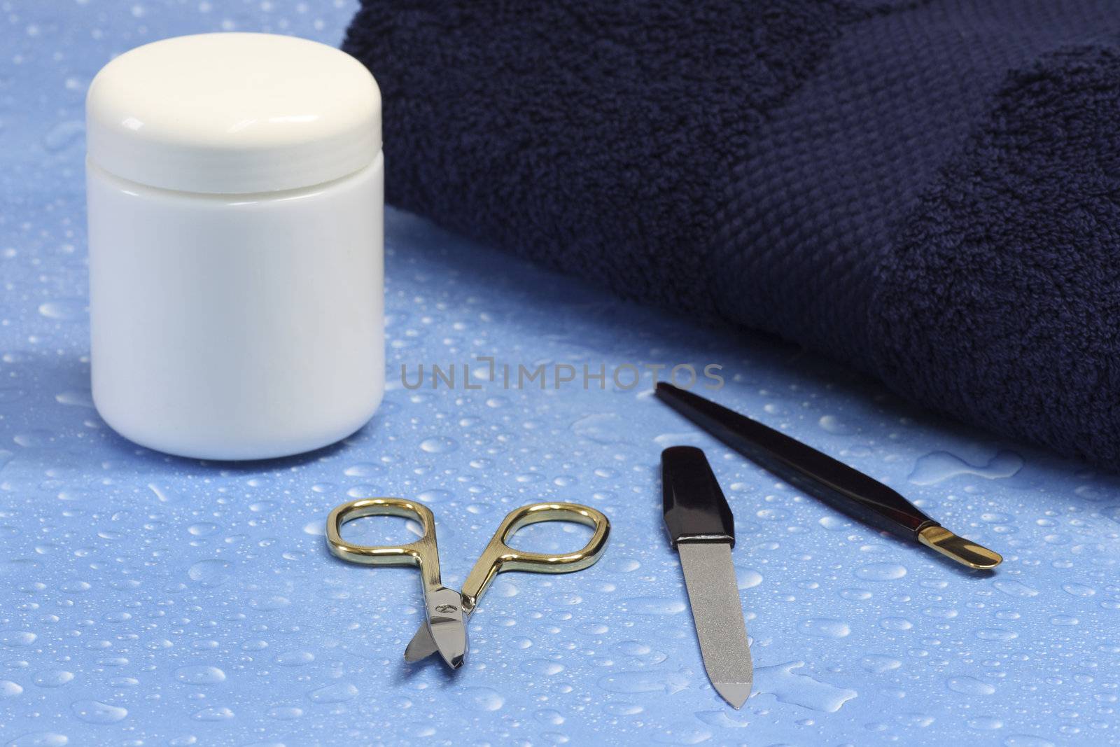 Manicure utensils over blue background