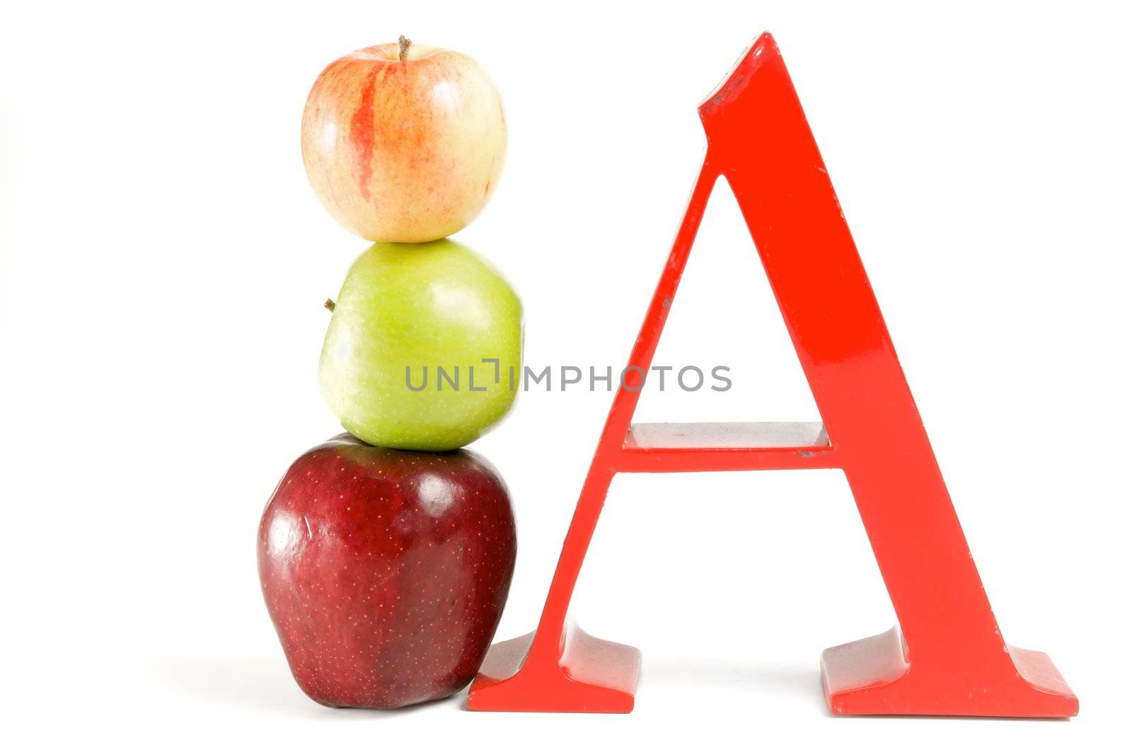 stack of apples next to large red letter A