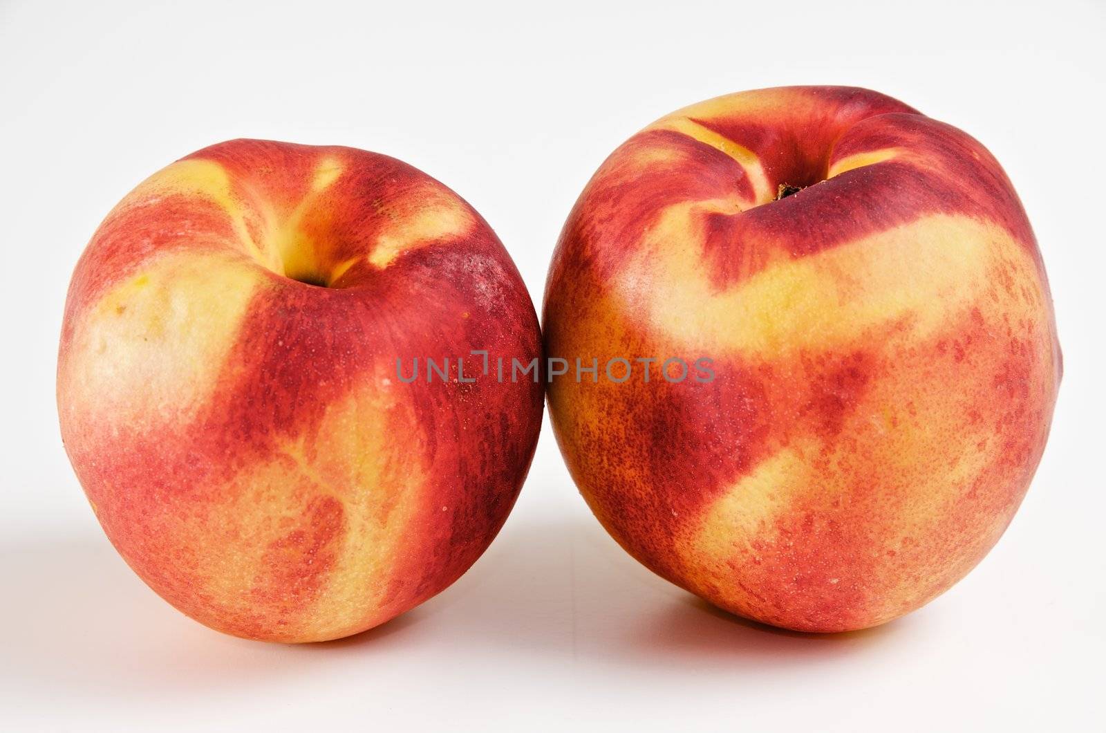 pair of ripe nectarines