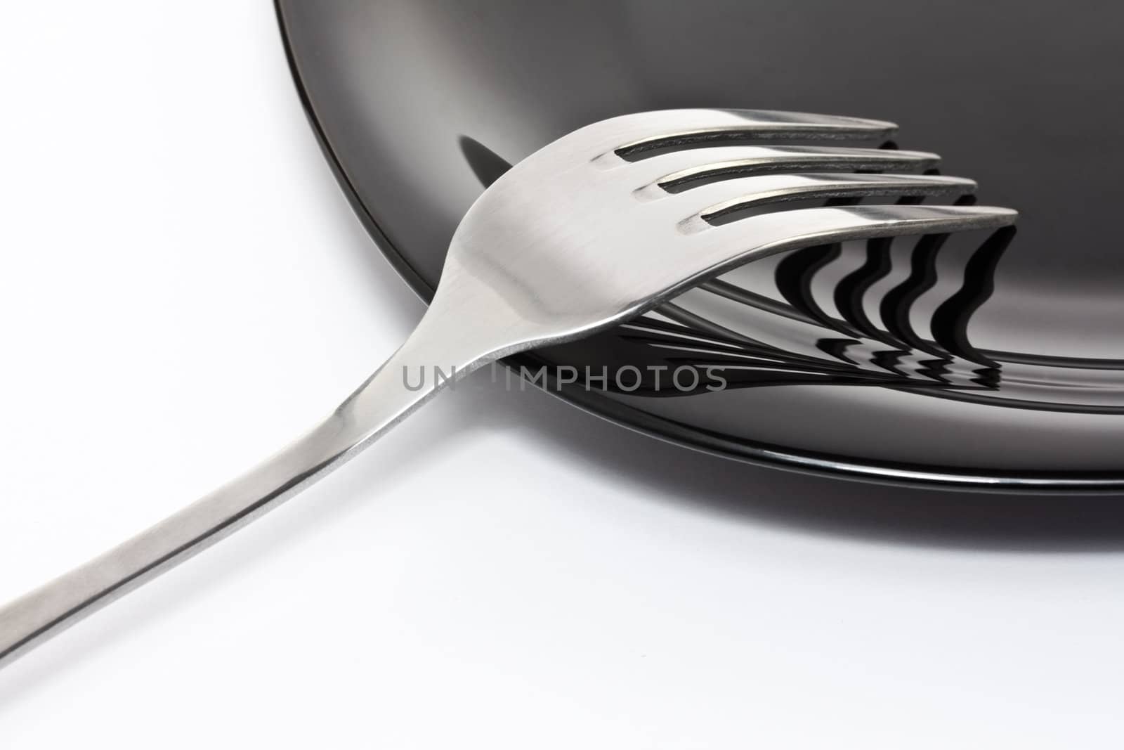 Black high-gloss plate with stainless fork