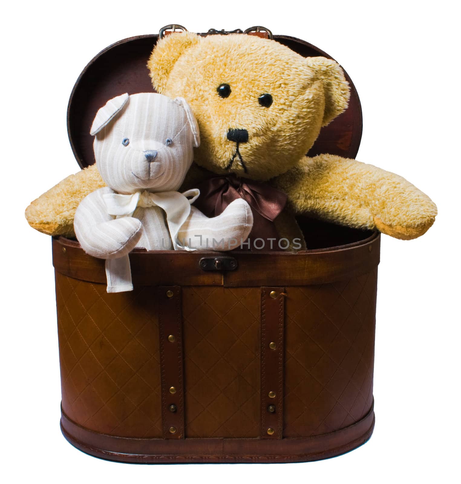 toys sitting in vintage case  isolated over white with clipping path