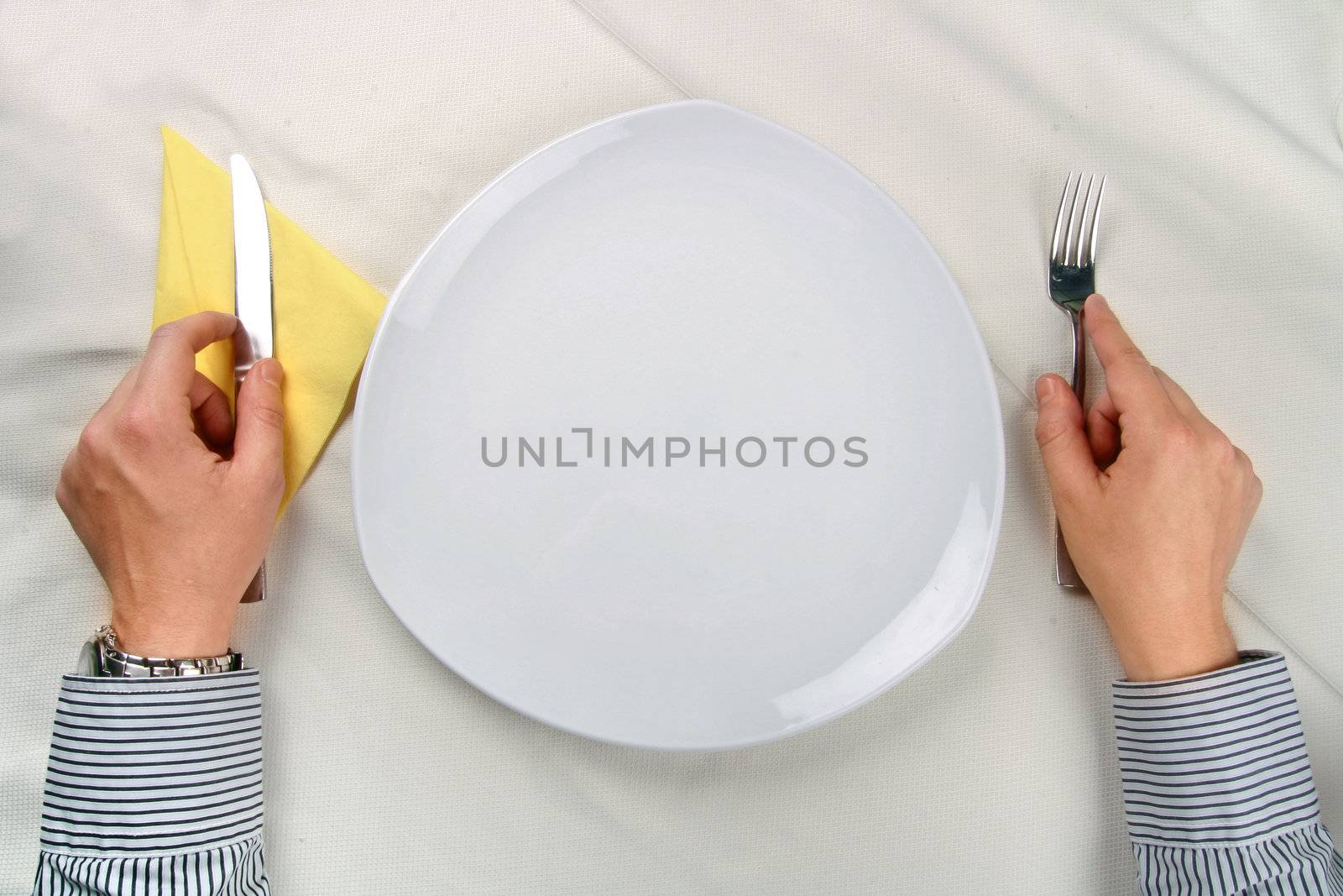 Man waiting near an empty plate