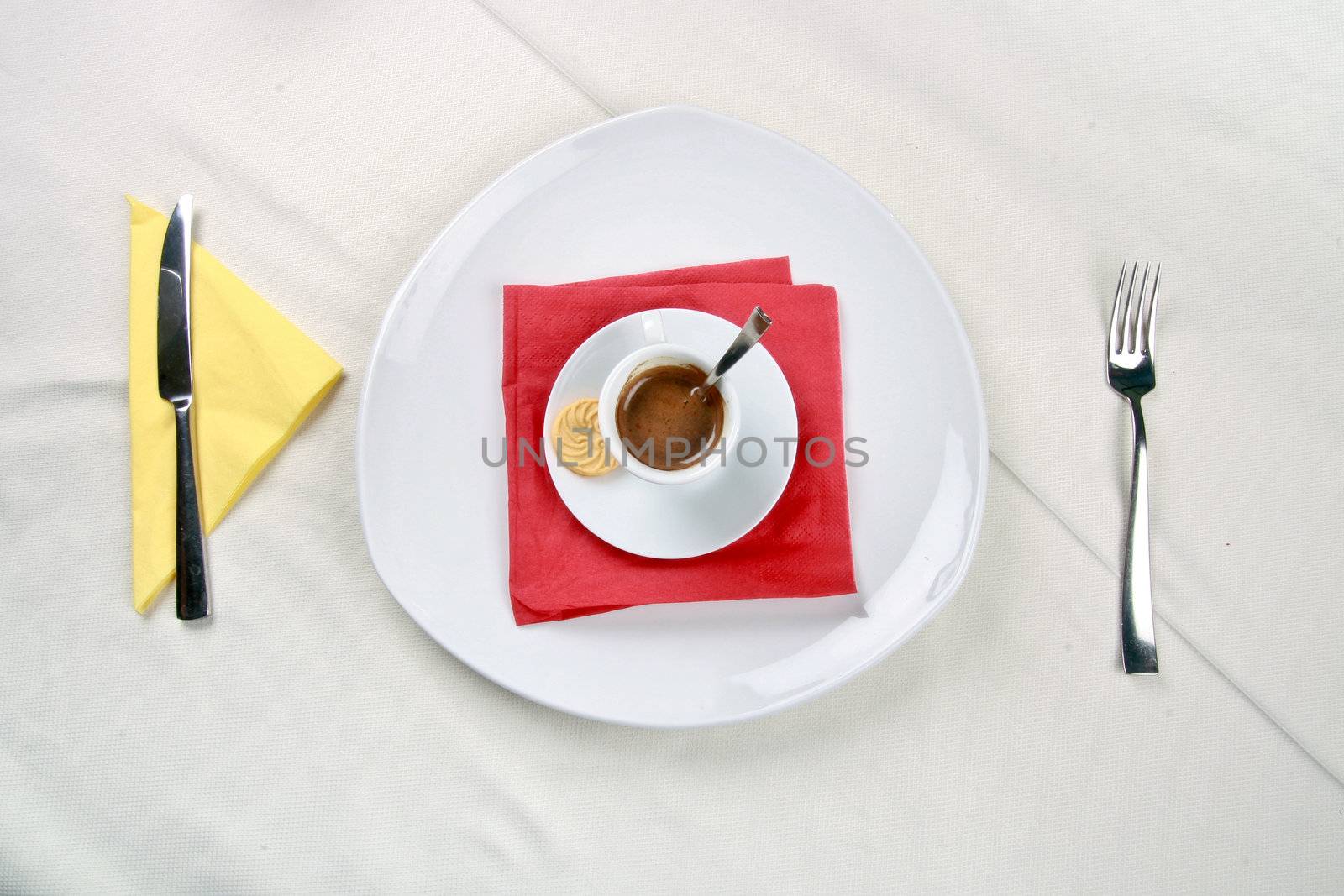 A plate with a cup of coffee on it
