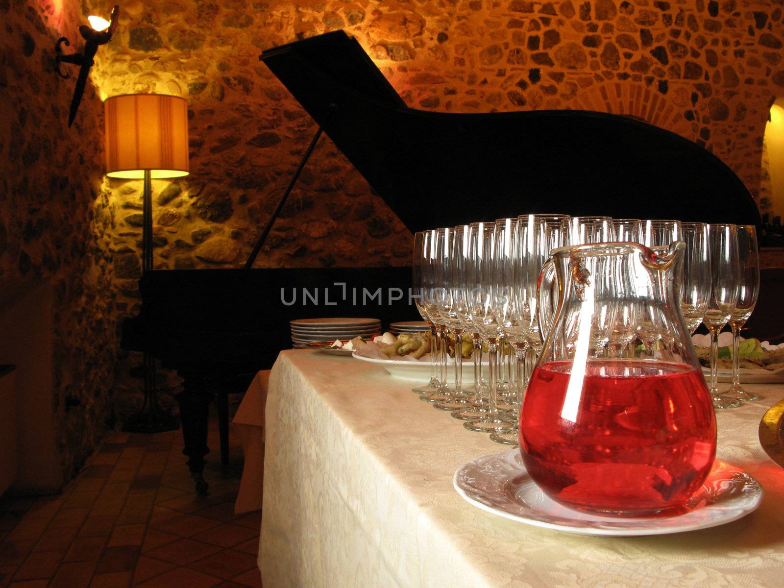 Cocktail aperitif in a restaurant with piano.