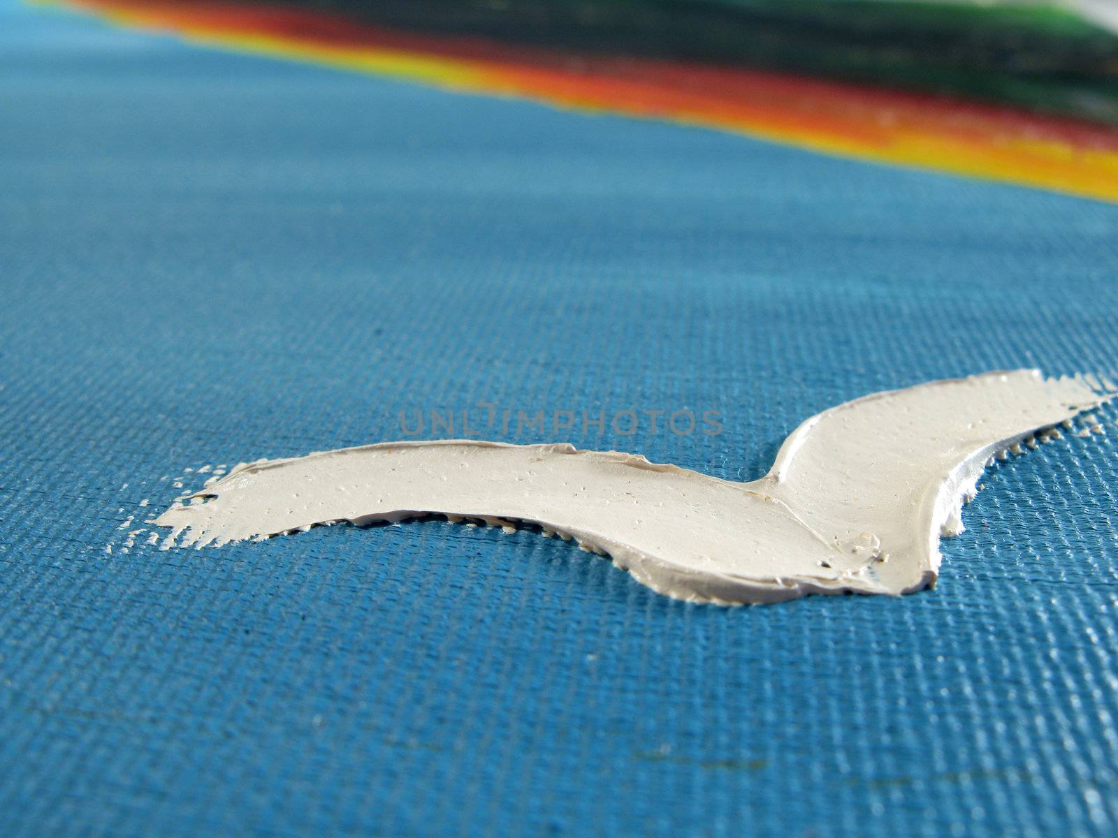 Painted abstract bird in the sky on canvas (macro prospective).