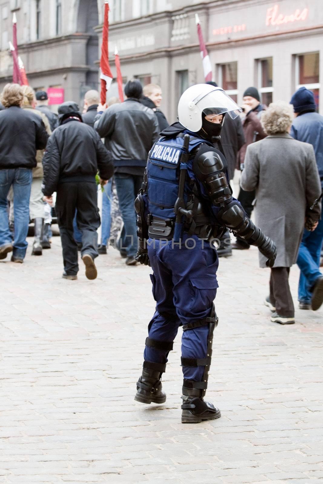 Riga, Latvia, March 16, 2009. Riot police observing Commemoration of the Latvian Waffen SS unit or Legionnaires.The event is always drawing crowds of nationalist supporters and anti-fascist demonstrators. Many Latvians legionnaires were forcibly called uo to join the Latvian SS Legion.