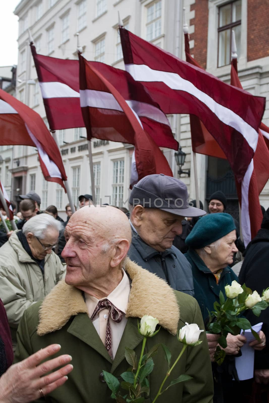Riga, Latvia, March 16, 2009. Former veterans of the Latvian Legion and their families leaving Dome churche after service to the Freedom monument. Commemoration of the Latvian Waffen SS unit or Legionnaires is always drawing crowds of nationalist supporters and anti-fascists. Many Latvians legionnaires were forcibly called to join the Latvian SS Legion.