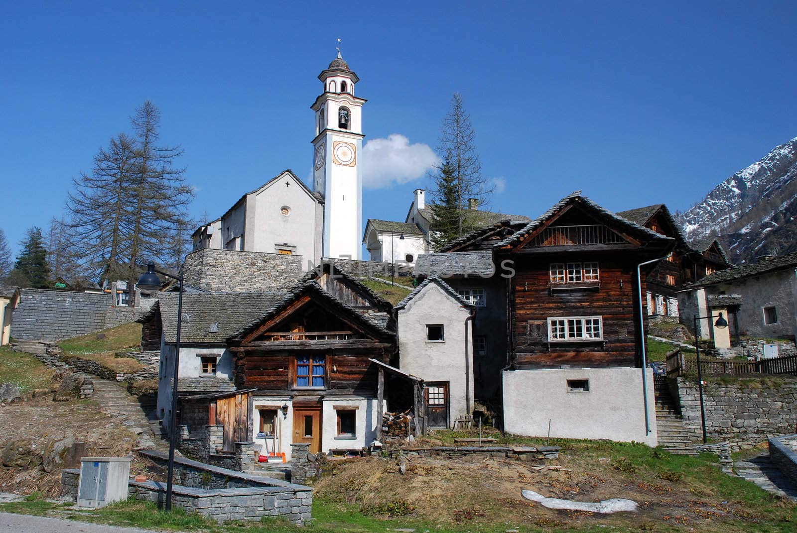 Bosco Gurin retains the charm of one of the most charming mountain villages of Switzerland. There typical leaving houses of the village and the church at the background